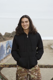 Pacific Islander man with hands in pockets