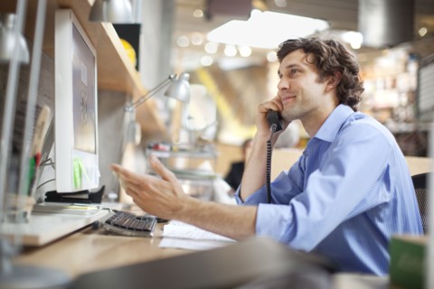 Hispanic businessman talking on telephone