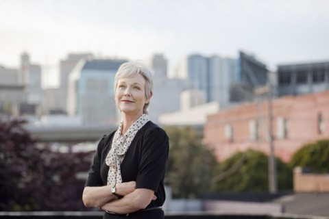 Portrait of pensive Caucasian businesswoman posing outdoors