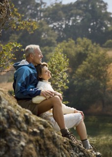 Couple sitting on rocks and relaxing