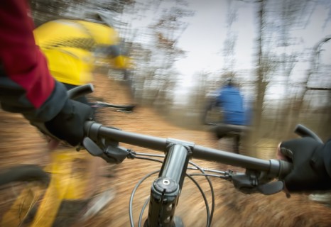 Blurred view of mountain bike in forest
