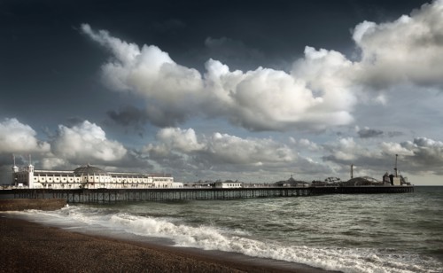 Clouds over boardwalk and beach