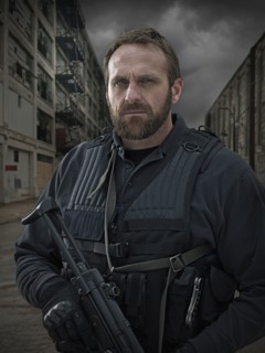 Caucasian policeman on city street