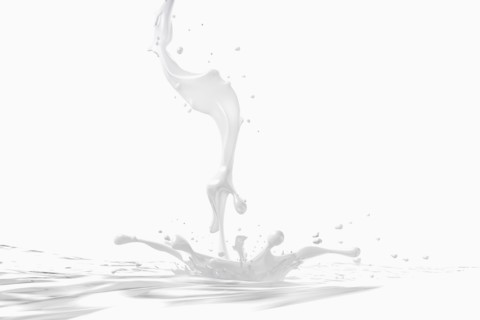 Milk stream splashing into pool
