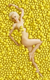 Caucasian woman laying in pile of lemons