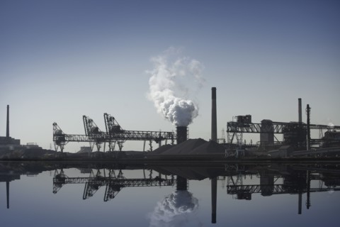 Nuclear power plant reflected in still lake