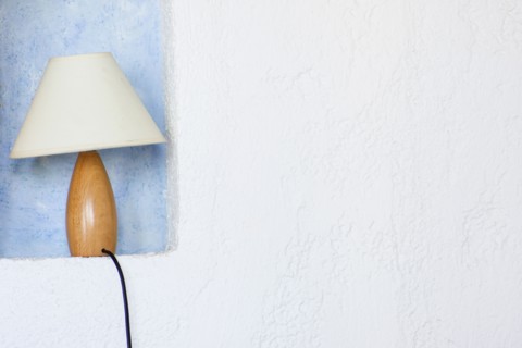 Close up of lamp in wall sconce