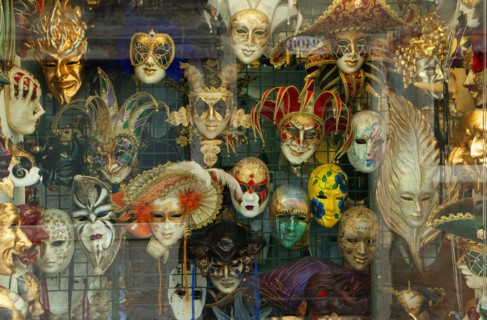 Decorative masks hanging in store window