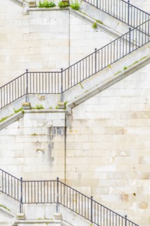 Banister and staircase on tall building