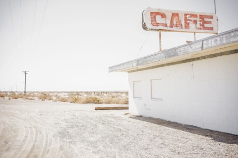 Abandoned cafe on rural dirt road