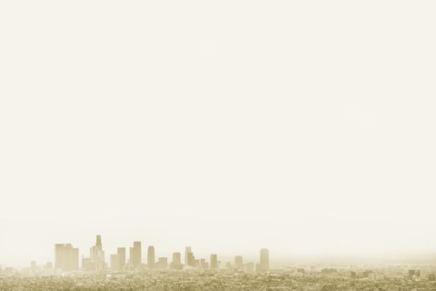 Silhouette of city skyline in hazy sky