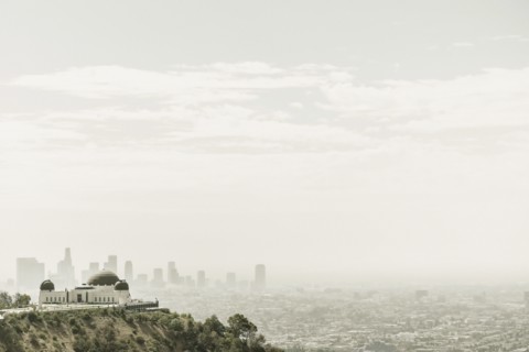 Observatory and city skyline in hazy sky