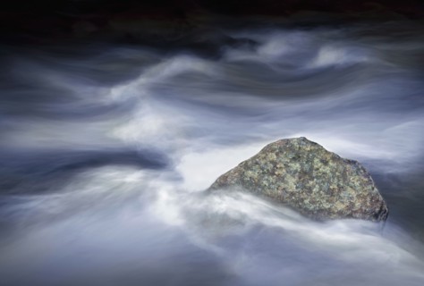 Time lapse view of fog clouds over rock