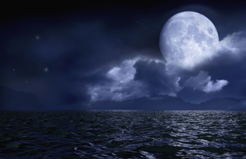 Full moon over seascape and horizon