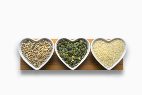 Heart-shaped bowls of heart-healthy seeds
