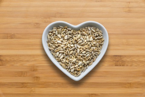 Heart-shaped bowls of heart-healthy seeds