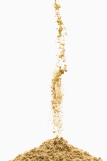 Brown powder pouring into pile