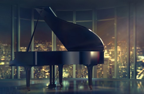 Grand piano near window with scenic view of city