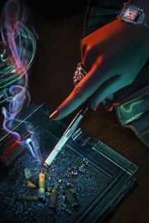 Hand of glamorous woman smoking cigarette