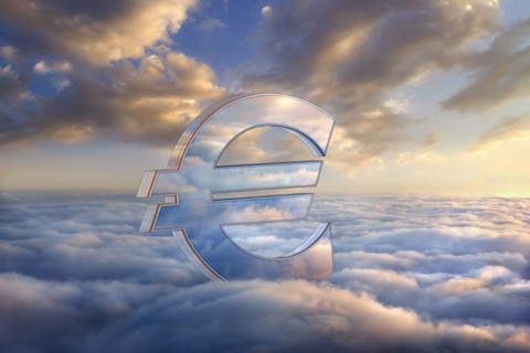 Reflection of clouds in euro symbol in sky