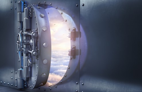 Open vault door revealing clouds in sky