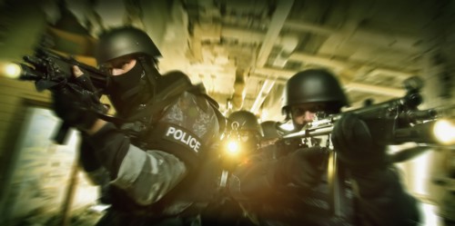 Police on the move aiming rifles