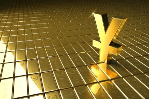 High angle view of gold bars and yuan symbol