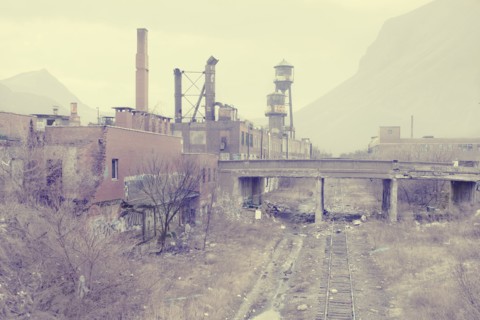 Dilapidated factory near railroad tracks