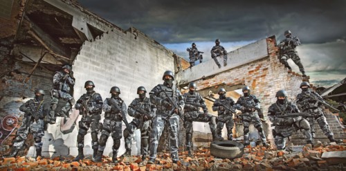Soldiers wearing masks on ruins in battlefield