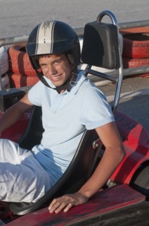 Hispanic teenager on go-cart track