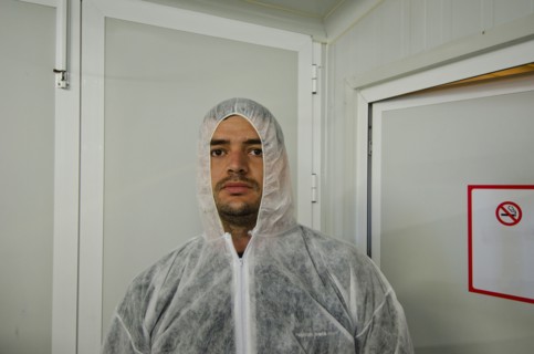 man in safety coverall in food processing plant
