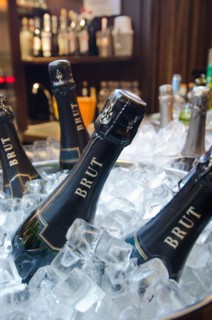 Wine bottles in ice bucket in restaurant