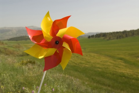 wind wheel over green fields