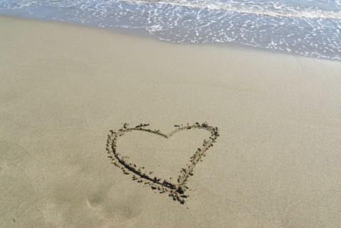 Spain Andalusia heart shape drawn in sand on beach