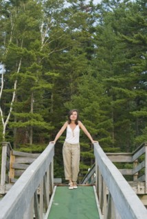 mature woman on wooden walkway