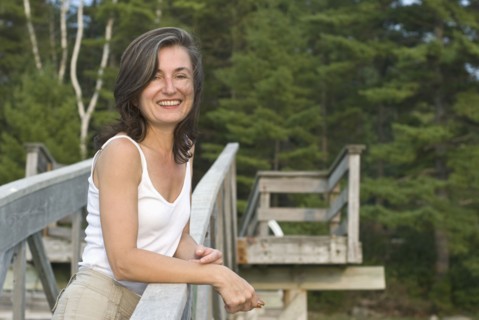 smiling woman on wooden walkway
