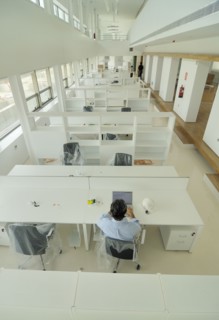 Man sitting in empty office elevated view