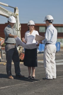 female and male architects in construction site