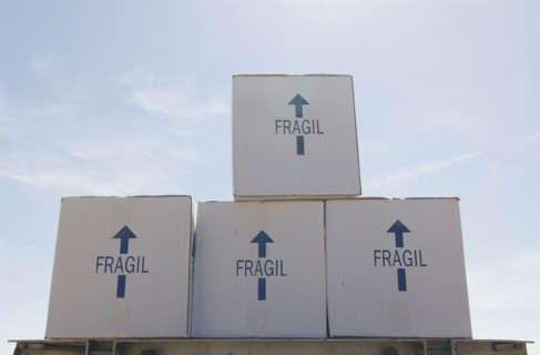 Removal boxes piled on crate low angle