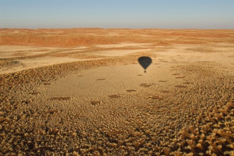 Namibia shadow of hot-air balloon above Namib Desert