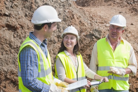 three engineers in construction site