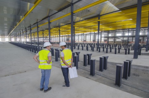 Workers talking in warehouse