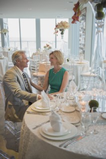 Caucasian couple talking in empty restaurant