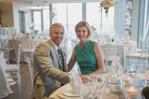 Caucasian couple smiling in empty restaurant