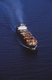 Aerial view of shipping barge sailing on ocean
