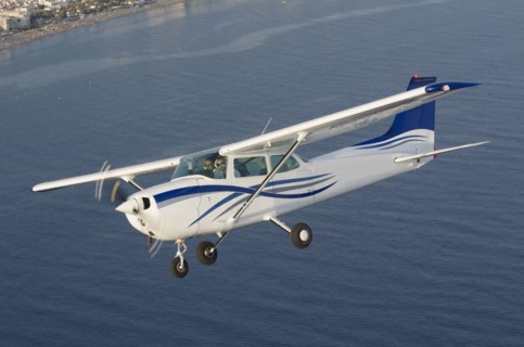 Aerial view of airplane flying over ocean
