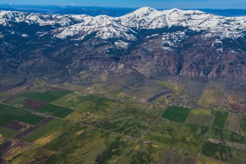 Aerial view of farmland and mountains