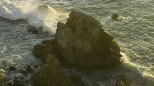 Ocean waves splashing on rocks