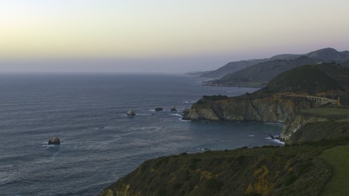 Scenic view of cliffs at ocean
