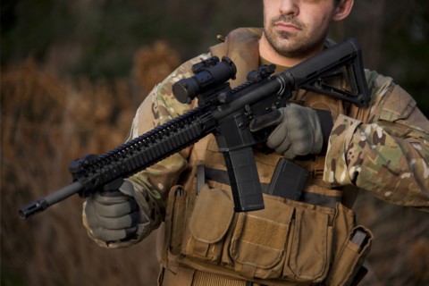 Soldier aiming automatic weapon during training
